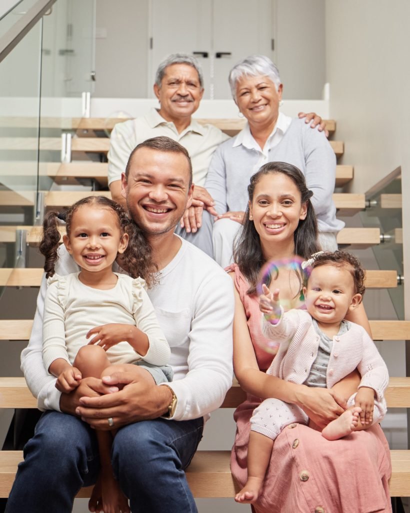 Big family, three generation and happiness of children, parents and grandparents sitting together o.