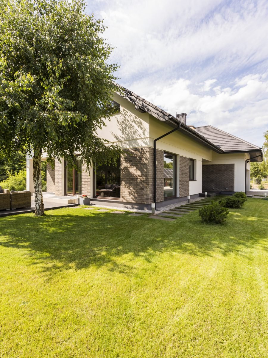 Yellow and big house with garden in the suburbs